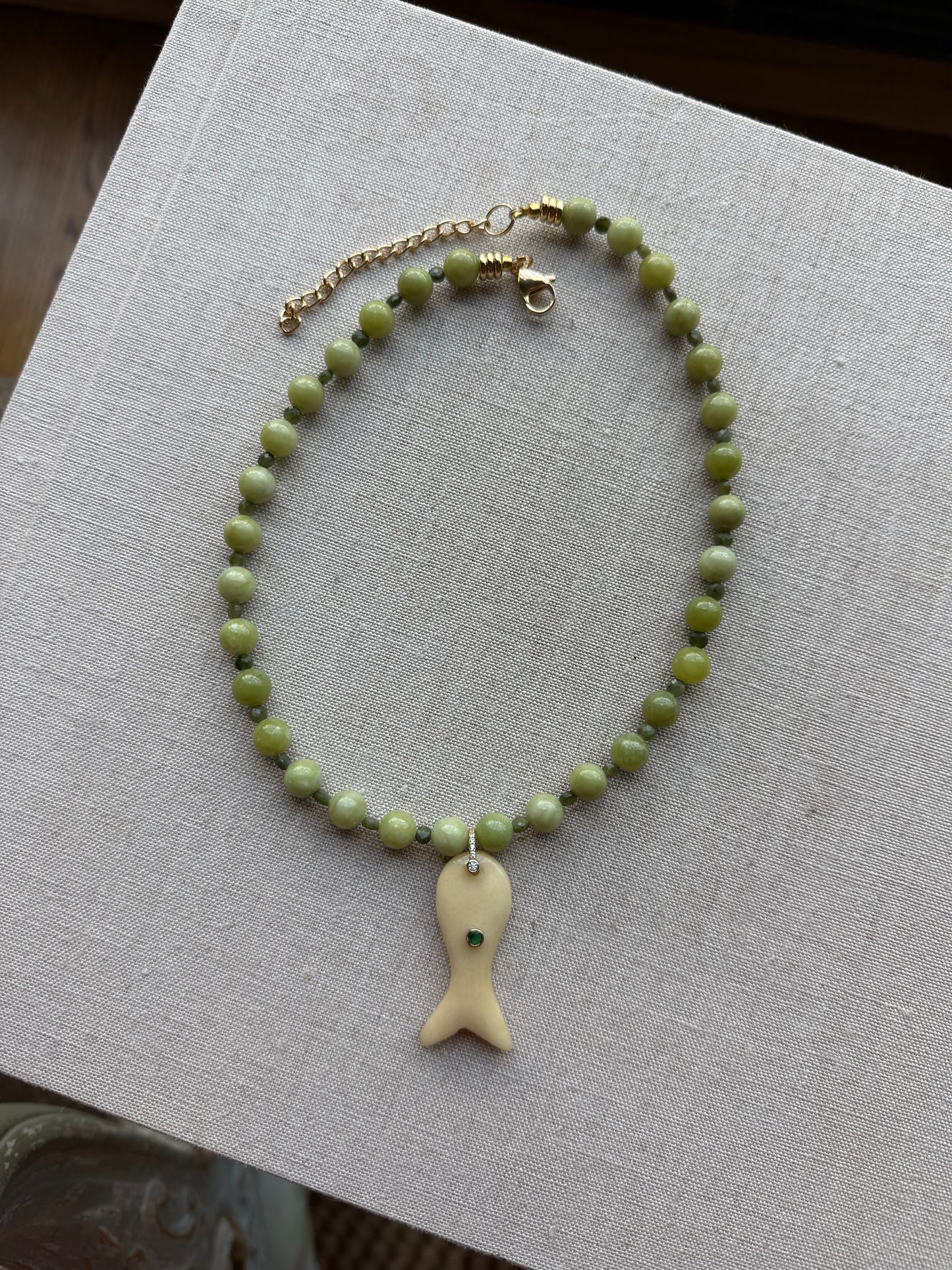 green fish necklace